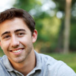 young-man-smiling-outside